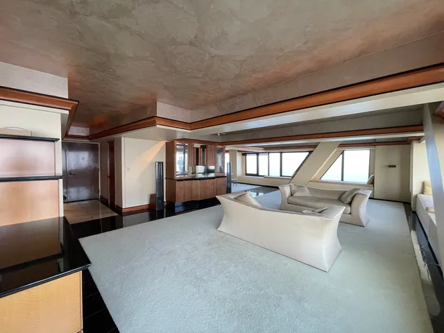 a room with dining table and chairs