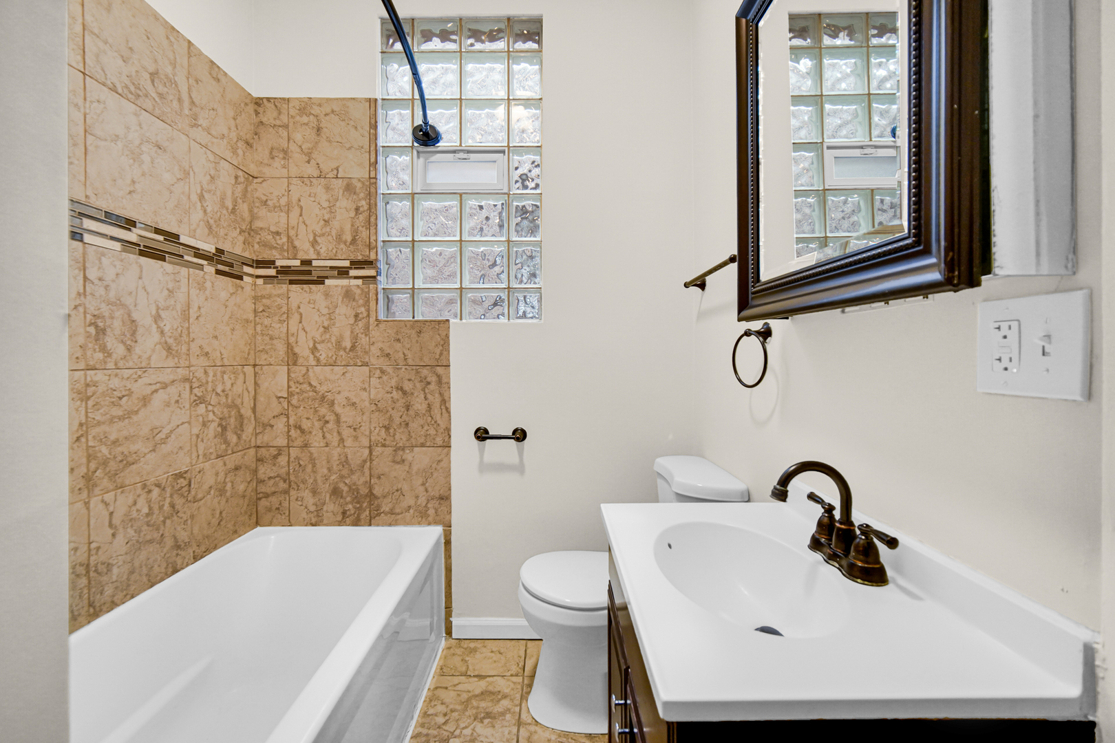 6520 South Ellis Avenue Chicago, IL 60637 - Photo 11 of 13 a bathroom with a sink a toilet and shower