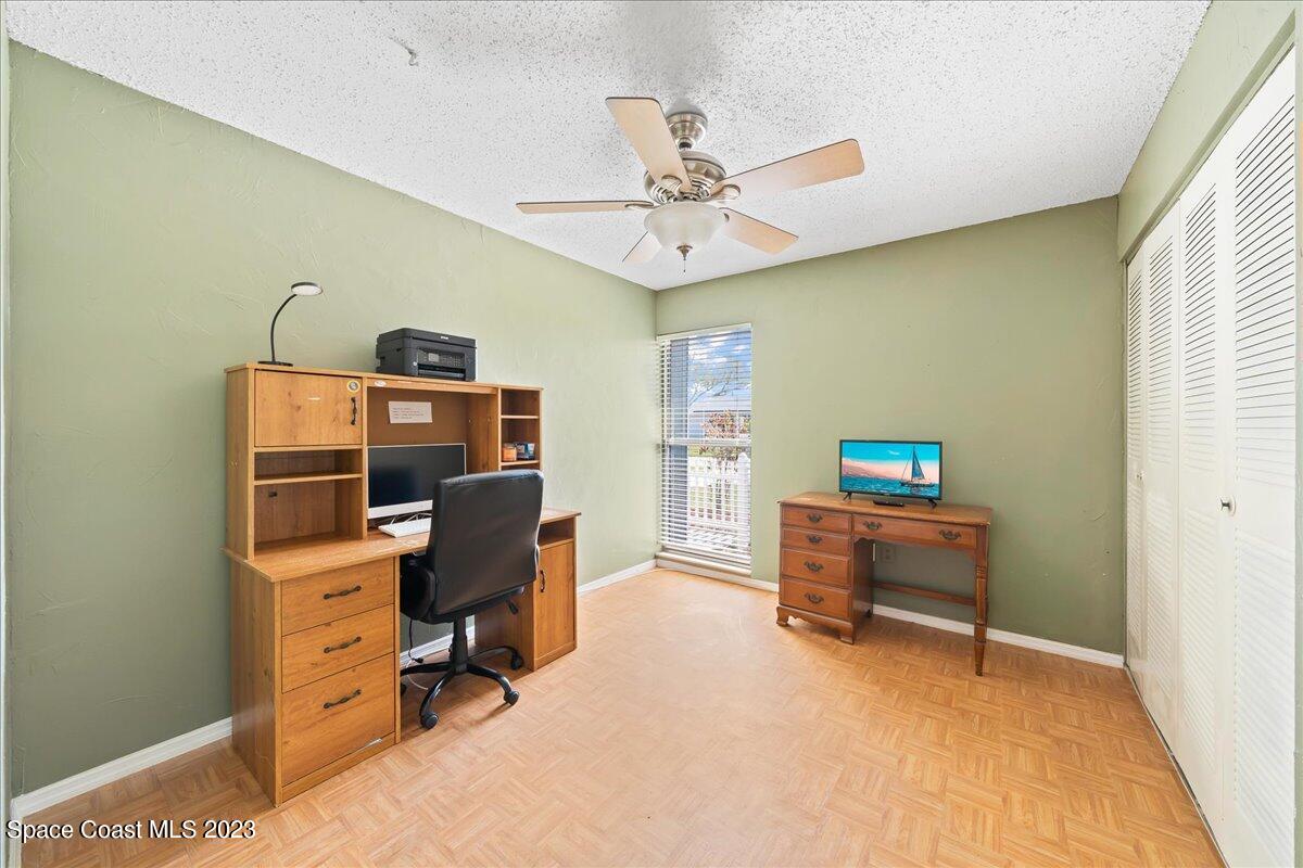 1379 Cromey Road Northeast Palm Bay, FL 32905 - Photo 18 of 25 a view of a workspace with furniture and a window