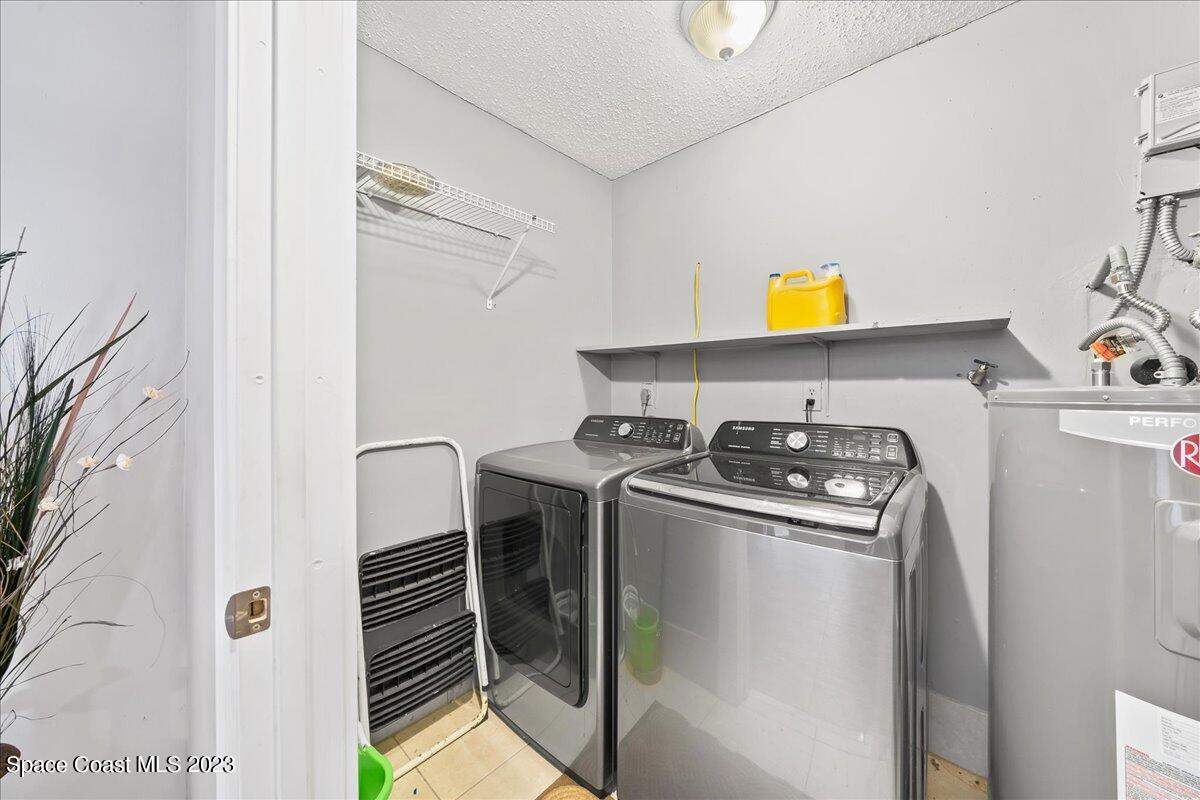 1379 Cromey Road Northeast Palm Bay, FL 32905 - Photo 19 of 25 a view of storage and utility room