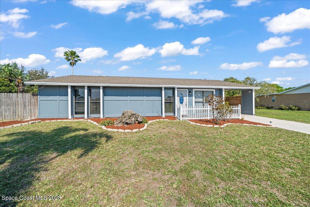 1379 Cromey Road Northeast Palm Bay, FL 32905 - Photo 2 of 25 a view of a house with backyard and porch
