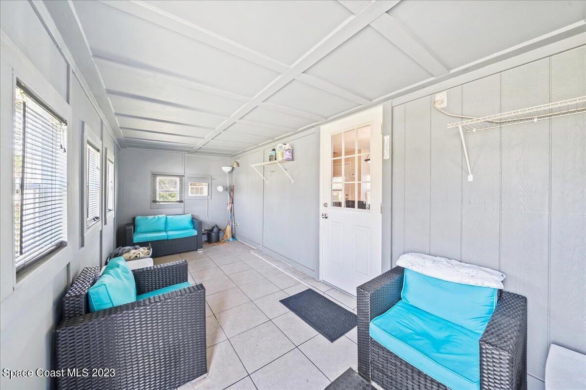 1379 Cromey Road Northeast Palm Bay, FL 32905 - Photo 21 of 25 a living room with furniture and a window
