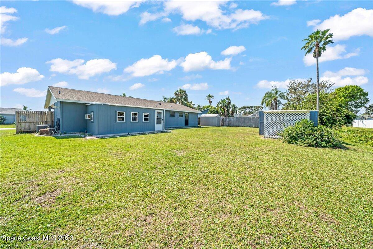 1379 Cromey Road Northeast Palm Bay, FL 32905 - Photo 24 of 25 a view of an outdoor space and swimming pool