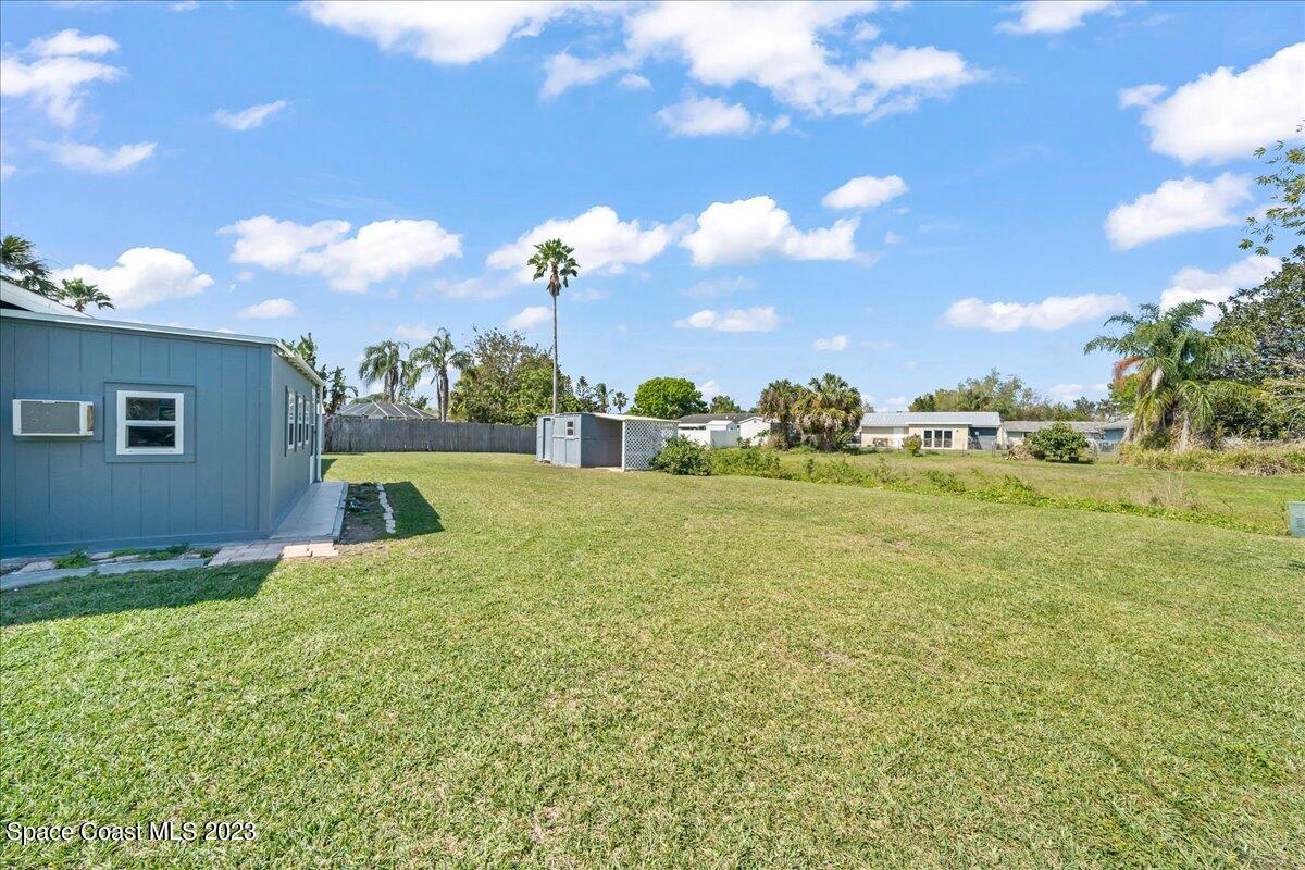 1379 Cromey Road Northeast Palm Bay, FL 32905 - Photo 25 of 25 a view of an outdoor space and a yard