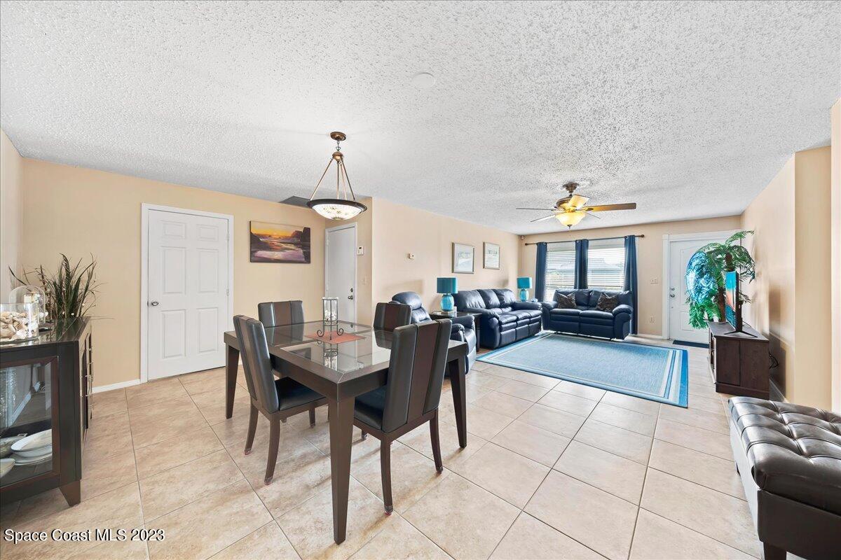 1379 Cromey Road Northeast Palm Bay, FL 32905 - Photo 8 of 25 a view of a dining room with furniture