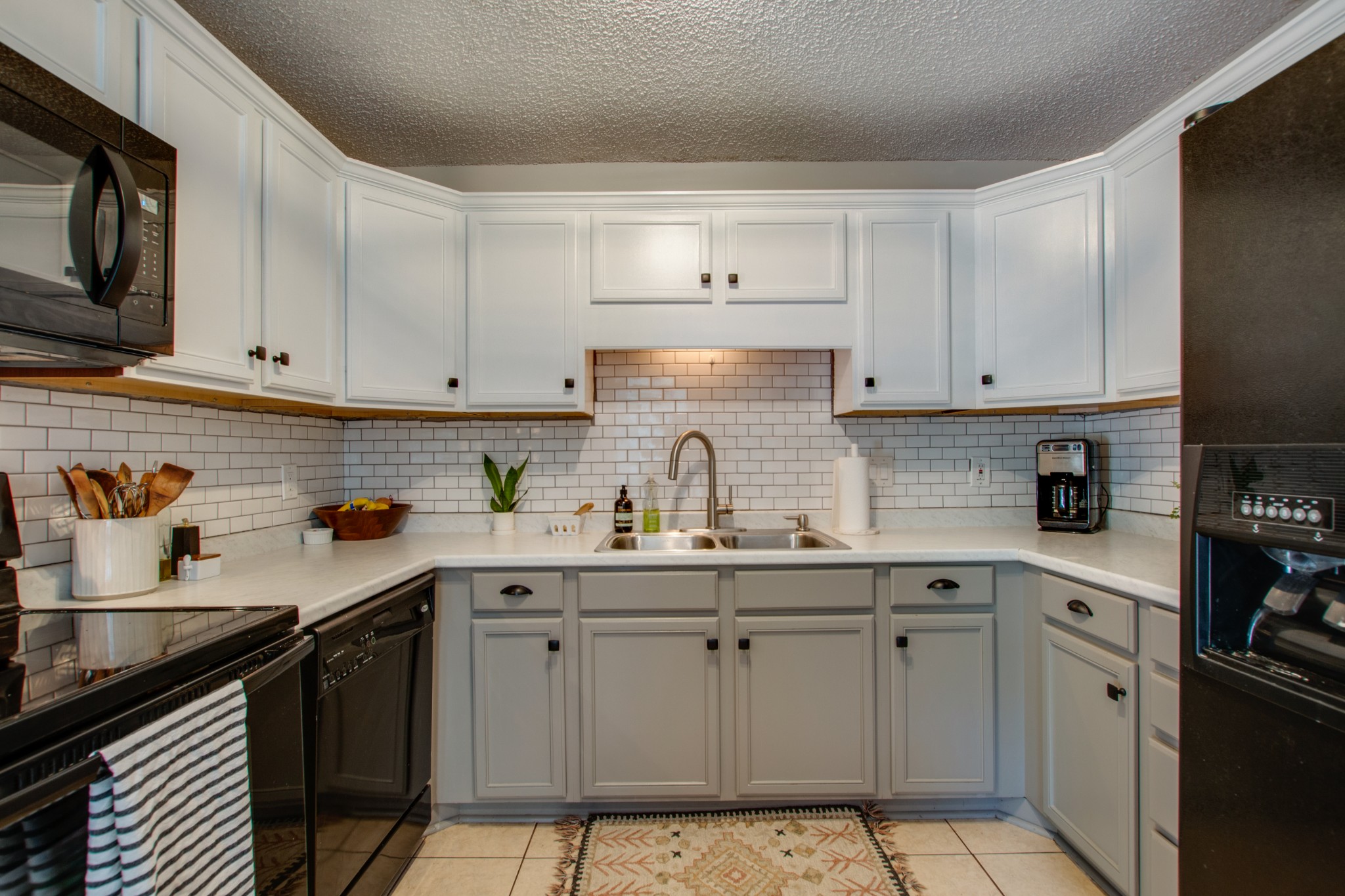 349 Cedarcliff Road Antioch, TN 37013 - Photo 13 of 27 a kitchen with stainless steel appliances granite countertop a sink a stove and cabinets