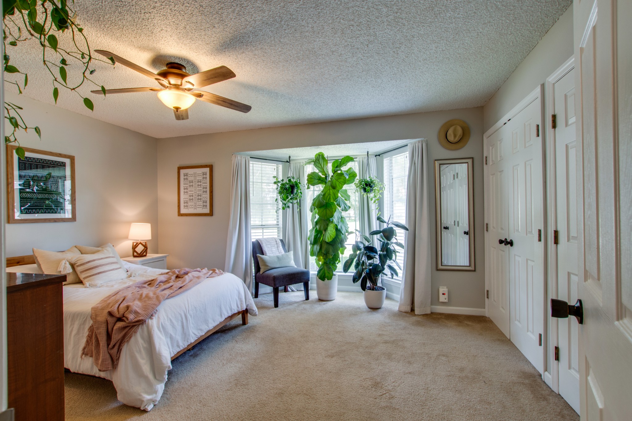 349 Cedarcliff Road Antioch, TN 37013 - Photo 16 of 27 a spacious bedroom with a bed and a chandelier
