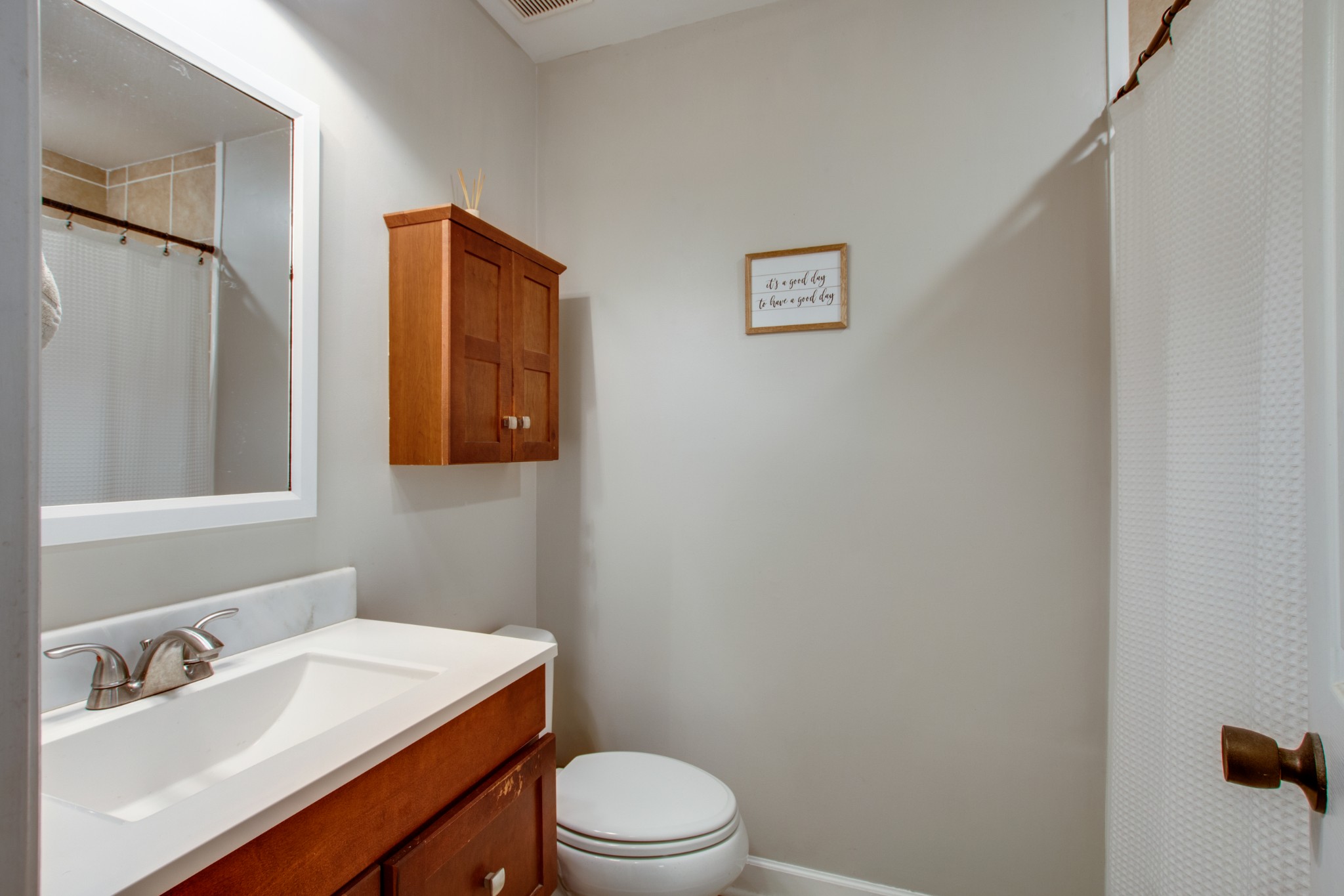349 Cedarcliff Road Antioch, TN 37013 - Photo 21 of 27 a bathroom with a sink a toilet and mirror