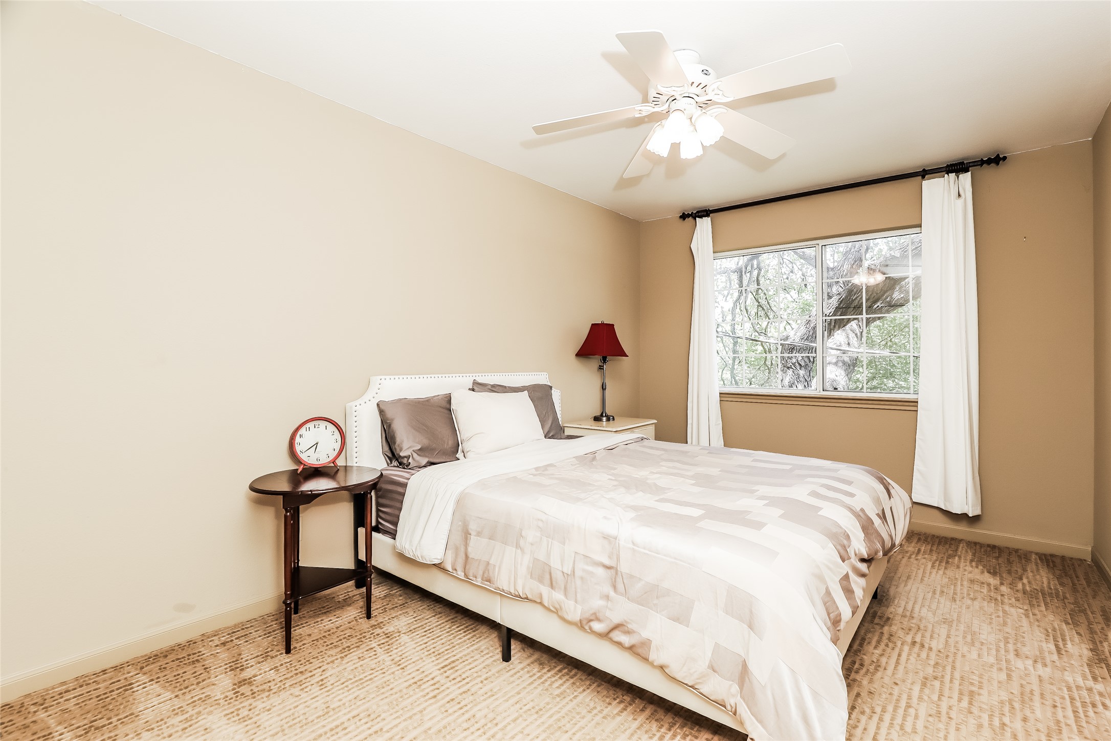 1702 Newning Avenue, Unit A Austin, TX 78704 - Photo 14 of 20 Neutral tone walls complemented by textured carpeting create a comfortable atmosphere