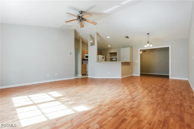 a view of a livingroom with a dishwasher and a window