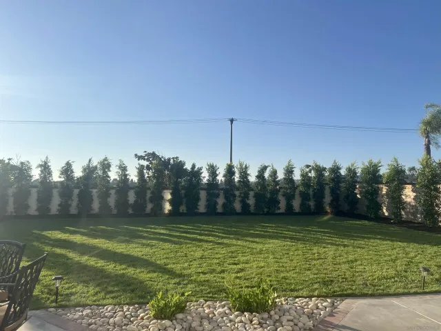 a view of a golf course with a trees