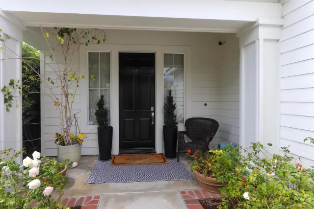 a front view of a house with outdoor seating