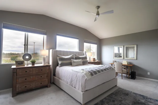 a bedroom with a bed and window