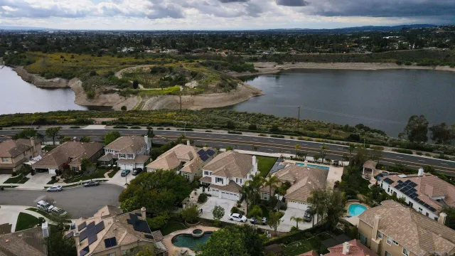 an aerial view of residential houses with outdoor space