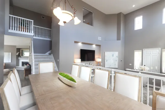a large white kitchen with a large window