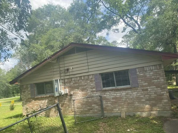 a backyard of a house with seating space
