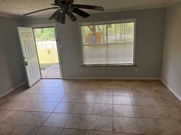 a view of an empty room with a window