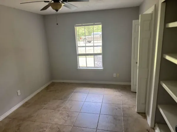 a view of an empty room with a window