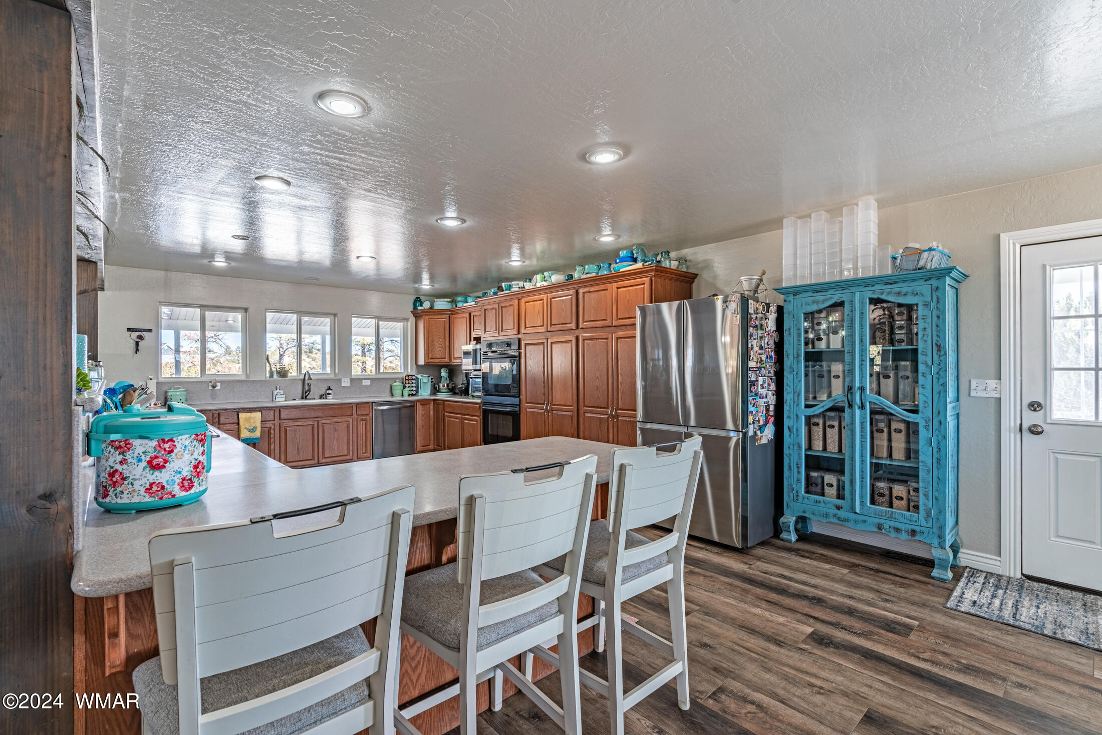 1108 Pearce Road Show Low, AZ 85901 - Photo 12 of 51 a view of a dining room with furniture a chandelier and wooden floor
