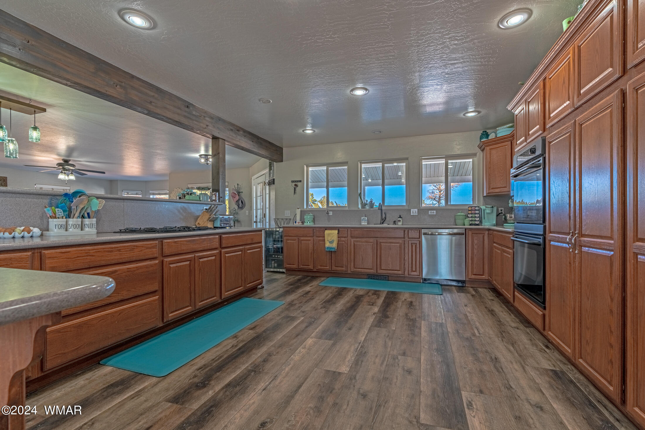 1108 Pearce Road Show Low, AZ 85901 - Photo 13 of 51 a kitchen with stainless steel appliances kitchen island granite countertop wooden cabinets and granite counter tops