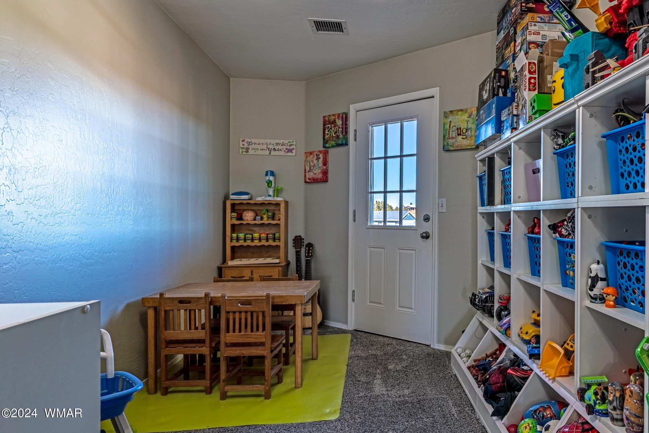 1108 Pearce Road Show Low, AZ 85901 - Photo 21 of 51 a work room with furniture and book shelf