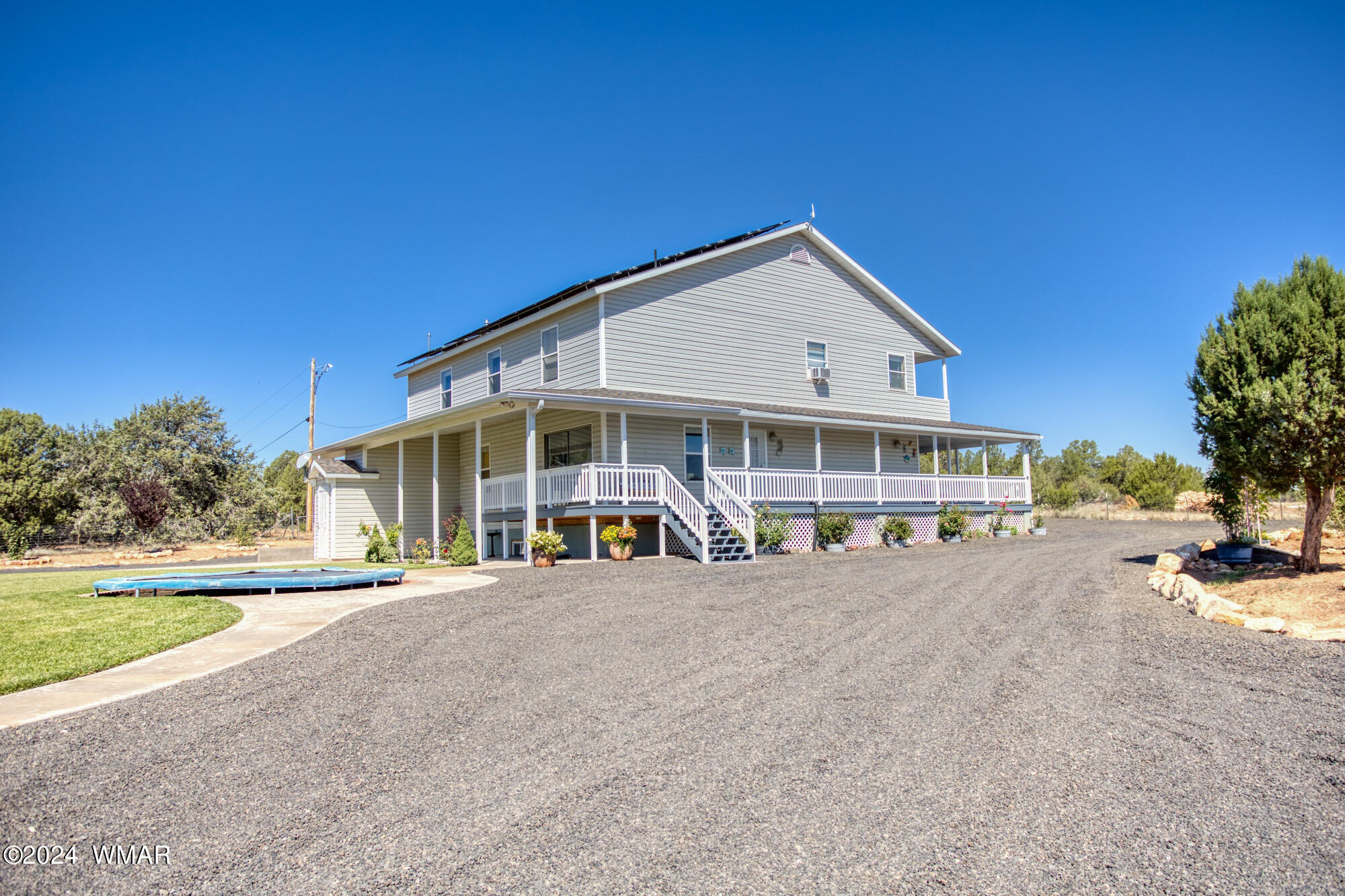 1108 Pearce Road Show Low, AZ 85901 - Photo 7 of 51 a view of a house with backyard and porch