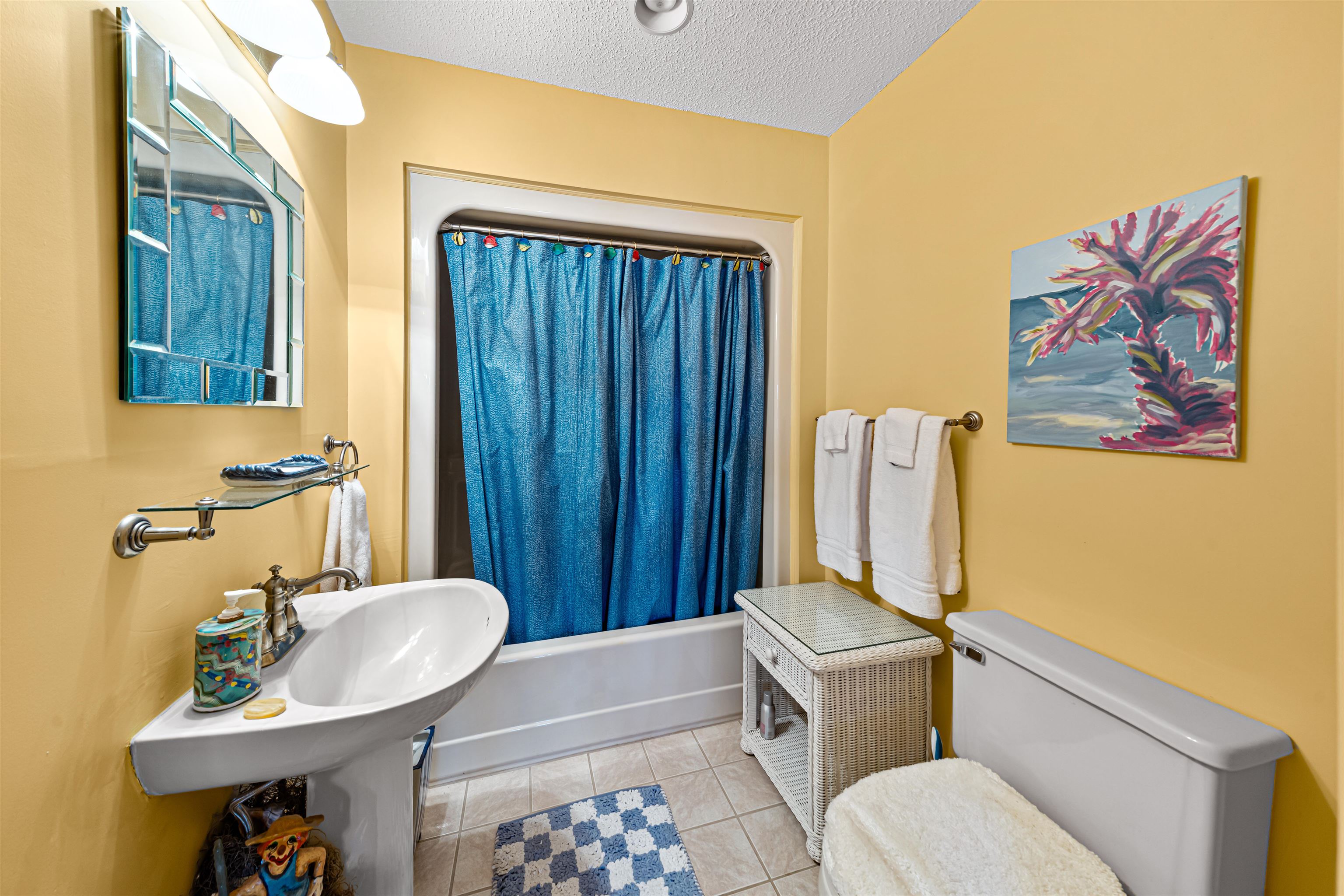 4801 Lightkeepers Way, Unit 17C Little River, SC 29566 - Photo 26 of 40 Full bathroom featuring a textured ceiling, light tile patterned floors, and shower / bath combo