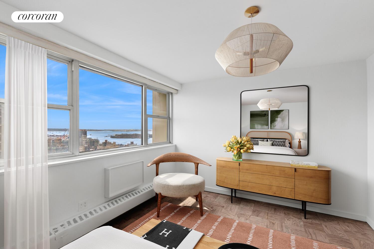 75 Henry Street, Unit 29H Brooklyn, NY 11201 - Photo 14 of 20 a room with a couch and chandelier