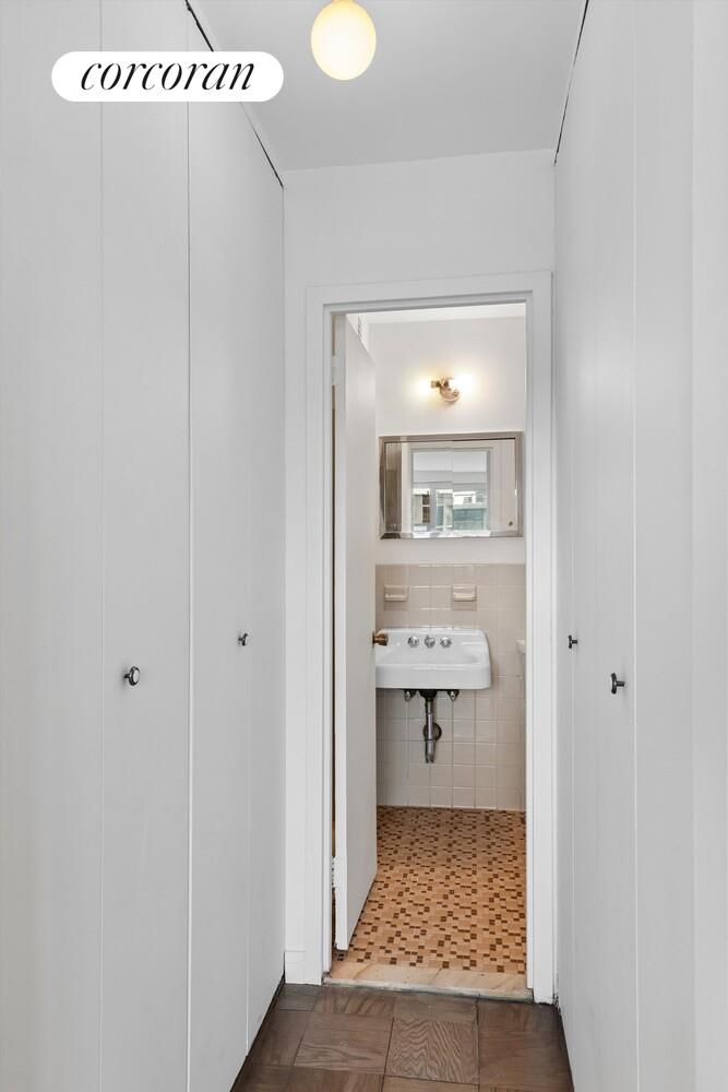 75 Henry Street, Unit 29H Brooklyn, NY 11201 - Photo 16 of 20 a bathroom with a glass door shower