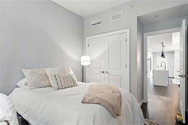 a bedroom with a bed and a view of bathroom