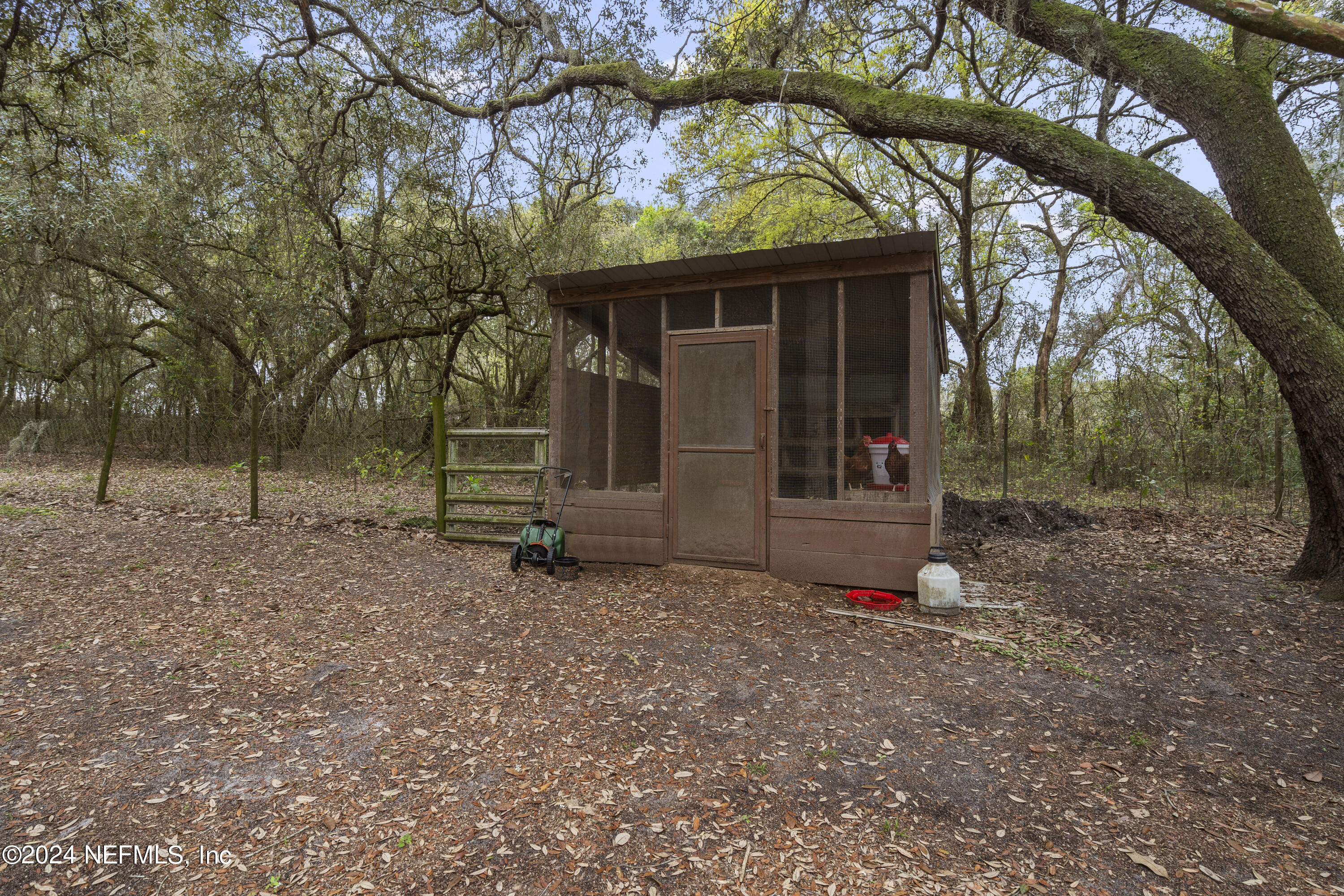 101 Tiffany Road Melrose, FL 32666 - Photo 17 of 51 a view of a small house with a tree in the forest