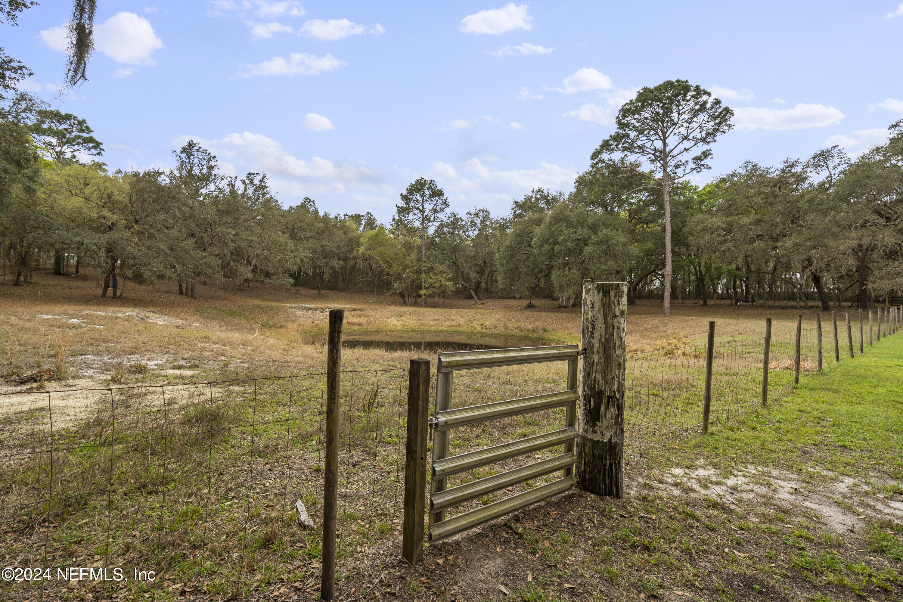 101 Tiffany Road Melrose, FL 32666 - Photo 23 of 51 a view of a lake with a yard