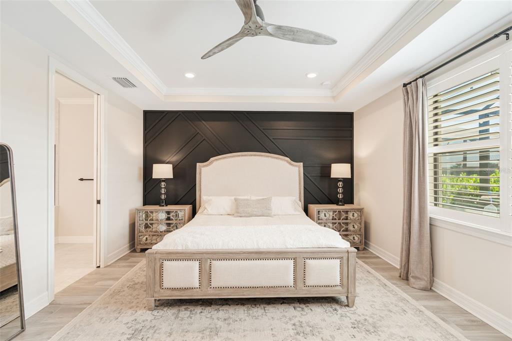 13303 Rinella Street Venice, FL 34293 - Photo 19 of 52 a living room with a bed furniture and a large window