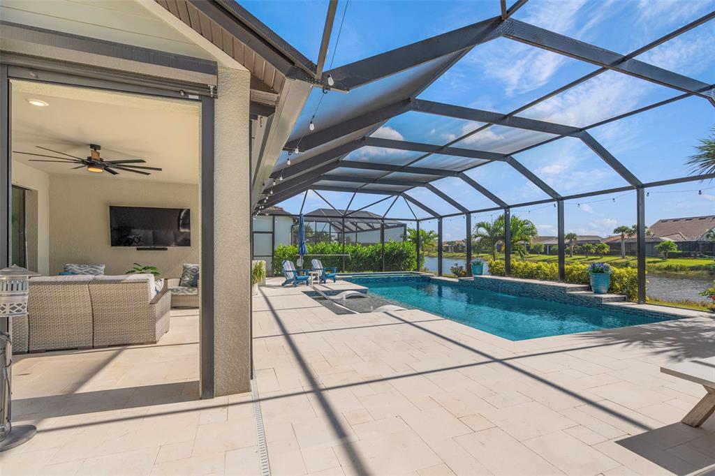 13303 Rinella Street Venice, FL 34293 - Photo 37 of 52 a view of a patio with a table and chairs