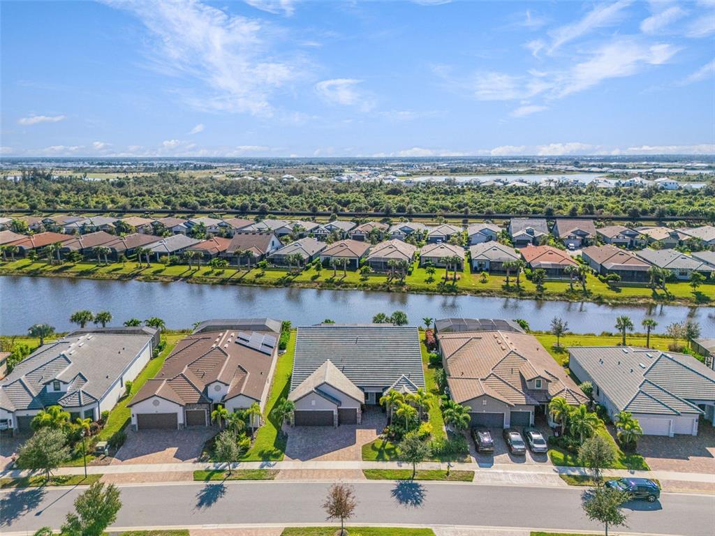 13303 Rinella Street Venice, FL 34293 - Photo 43 of 52 an aerial view of a houses with a lake
