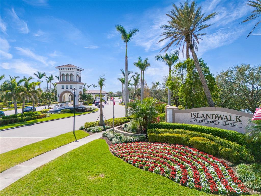 13303 Rinella Street Venice, FL 34293 - Photo 46 of 52 a view of a house with a yard and potted plants