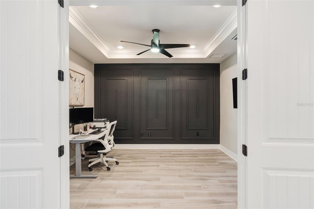 13303 Rinella Street Venice, FL 34293 - Photo 10 of 52 a view of a workspace with furniture and a ceiling fan