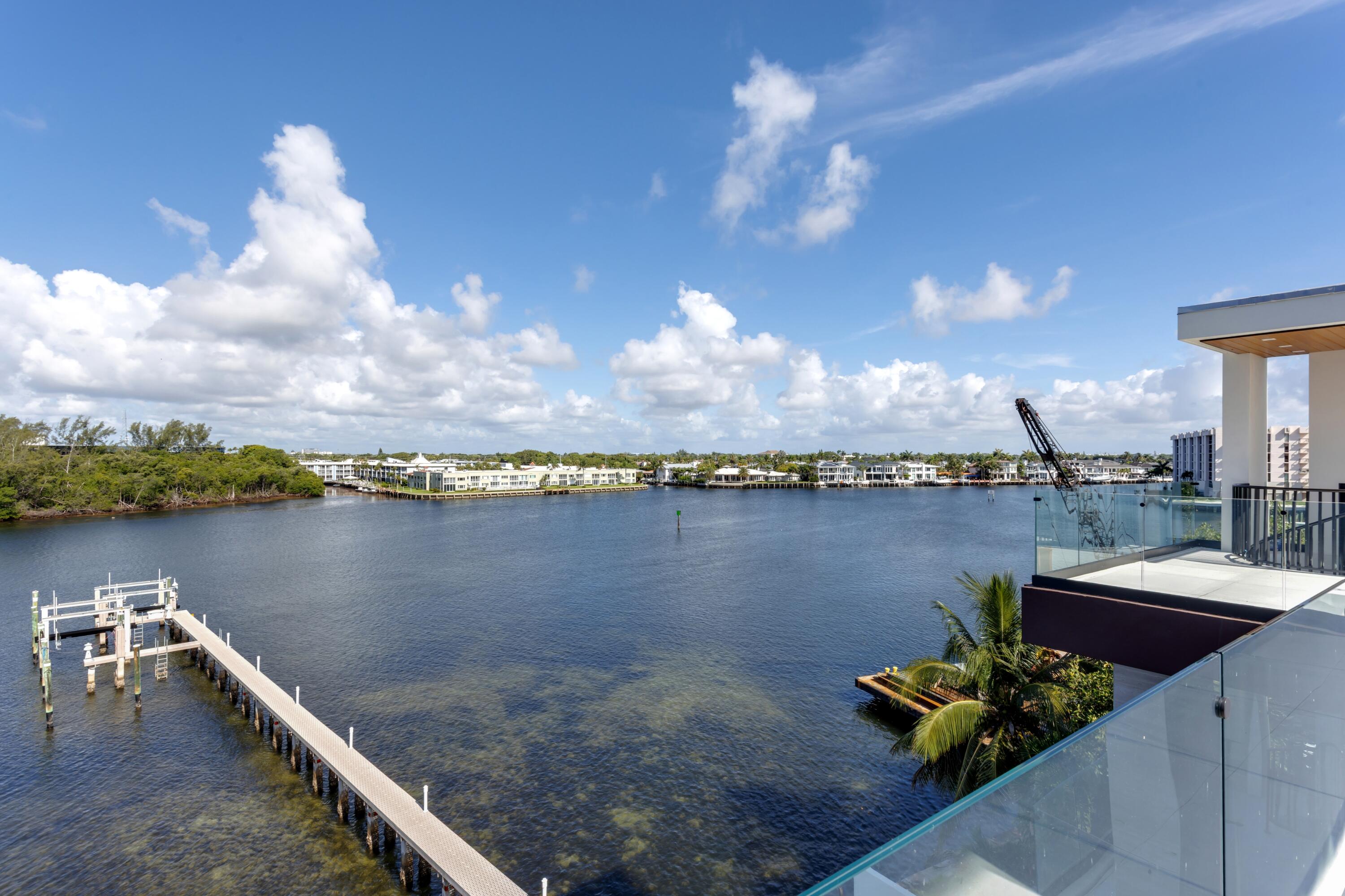 900 Lago Mar Lane, Unit PH Boca Raton, FL 33431 - Photo 46 of 58 a view of a lake with a terrace