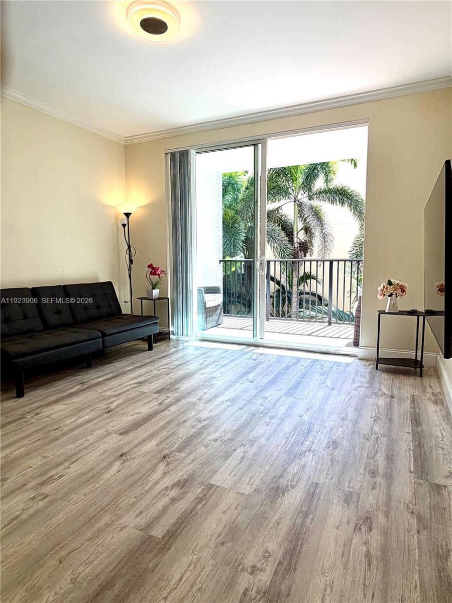 17150 North Bay Road, Unit 2419 Sunny Isles Beach, FL 33160 - Photo 1 of 27 a view of empty room with wooden floor and fan