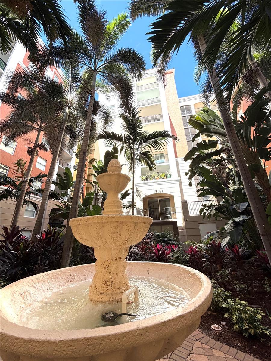 17150 North Bay Road, Unit 2419 Sunny Isles Beach, FL 33160 - Photo 20 of 27 a view of a fountain in the backyard of a house