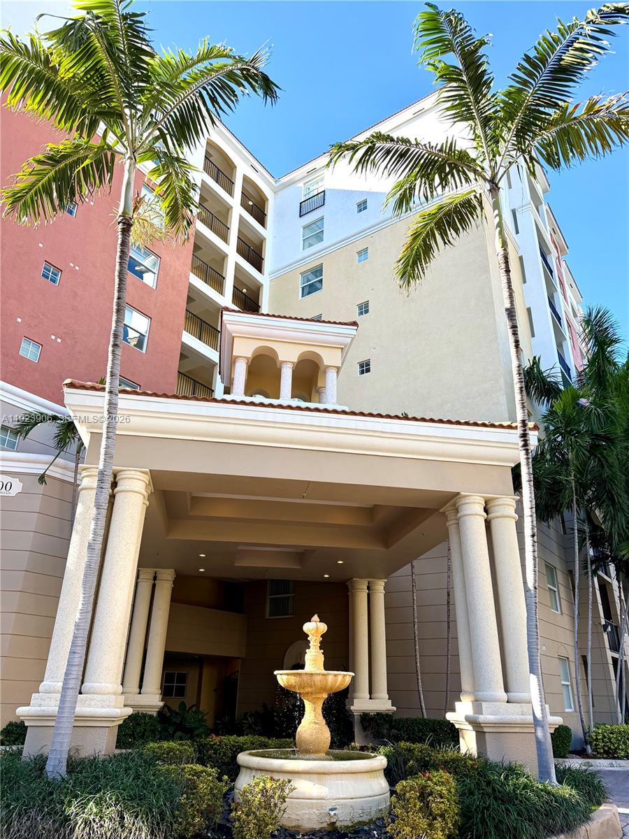 17150 North Bay Road, Unit 2419 Sunny Isles Beach, FL 33160 - Photo 23 of 27 a front view of a house with a tree