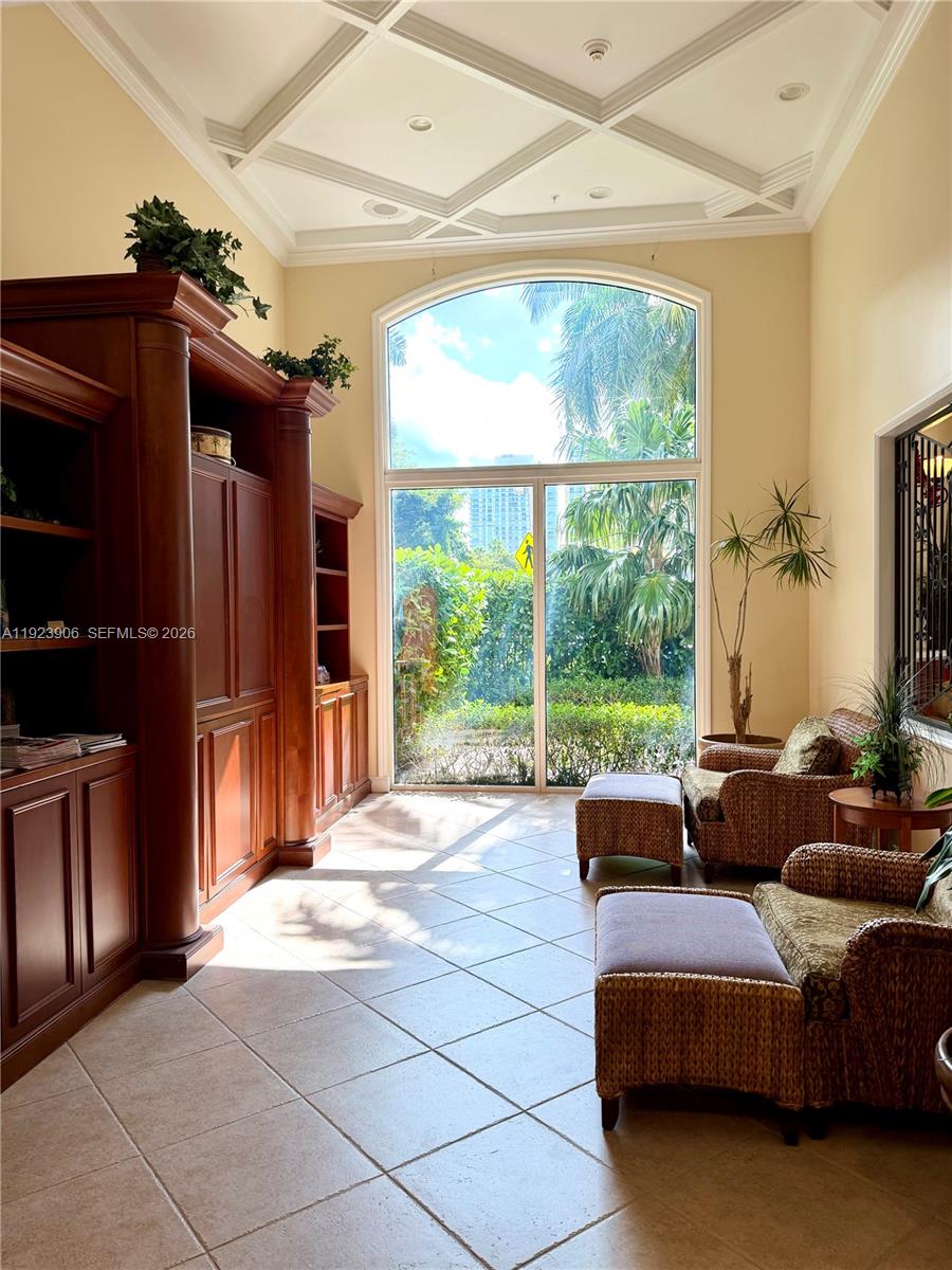17150 North Bay Road, Unit 2419 Sunny Isles Beach, FL 33160 - Photo 27 of 27 a living room with furniture and a flat screen tv