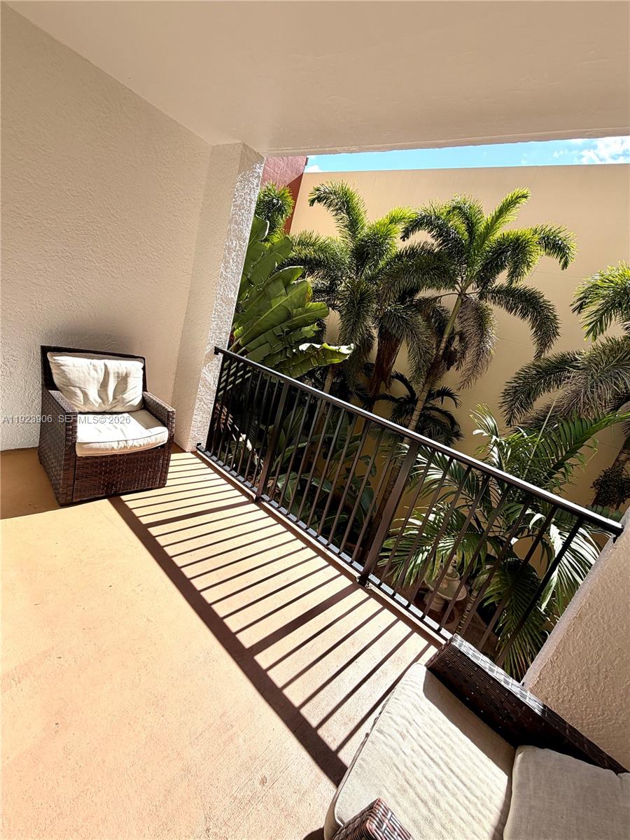 17150 North Bay Road, Unit 2419 Sunny Isles Beach, FL 33160 - Photo 5 of 27 a balcony with wooden floor