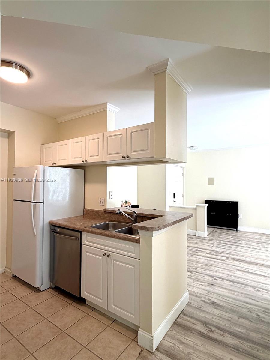 17150 North Bay Road, Unit 2419 Sunny Isles Beach, FL 33160 - Photo 8 of 27 a kitchen with stainless steel appliances granite countertop a stove and a refrigerator