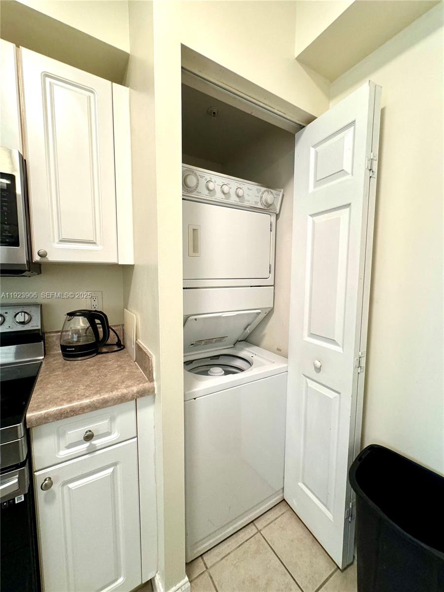 17150 North Bay Road, Unit 2419 Sunny Isles Beach, FL 33160 - Photo 9 of 12 a utility room with dryer and washer