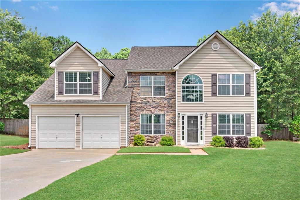 2117 Oakridge Avenue Monroe, GA 30656 - Photo 1 of 1 front view of a house and a yard