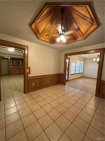 a view of a livingroom with an empty space and cabinets