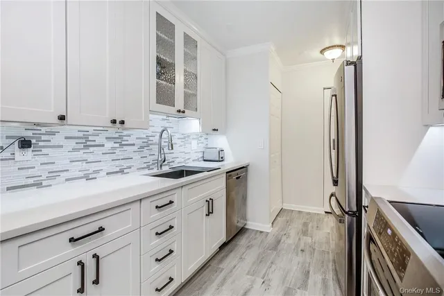 a kitchen with a stove a microwave and a dining table