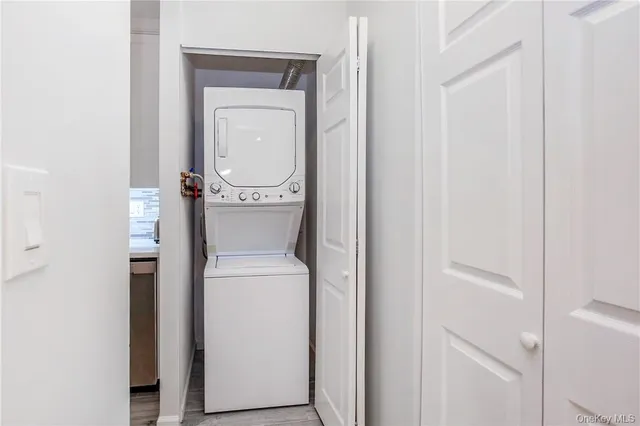 a kitchen with cabinets appliances and a wooden floor