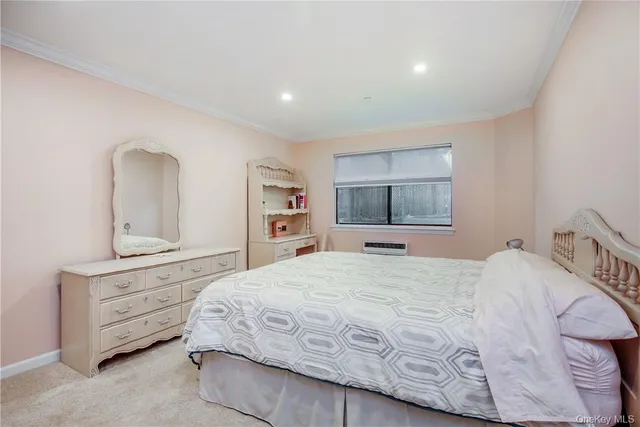 a bedroom with bed and window